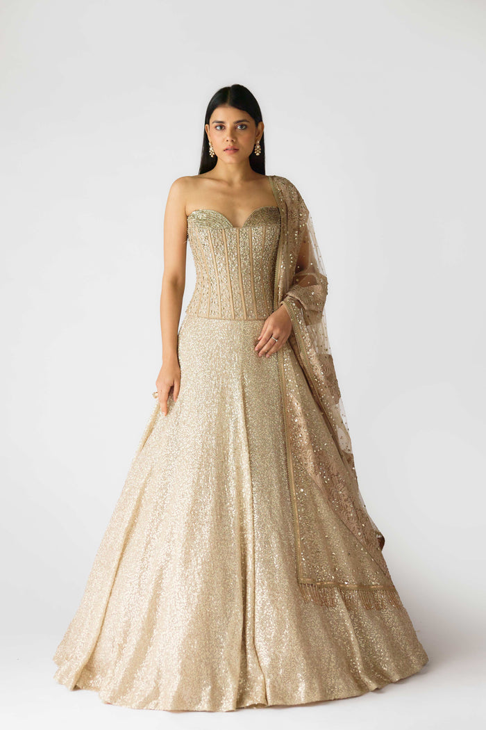 GOLDEN LEHENGA FEATURING EMBELLISHED CORSET BLOUSE