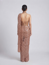 Back view of gold embroidered halter neck saree blouse