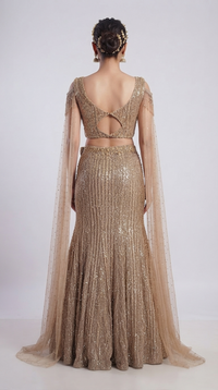 Champagne designer fish cut lehenga set with embroidered blouse, sequin embellishments and elegant festive detailing