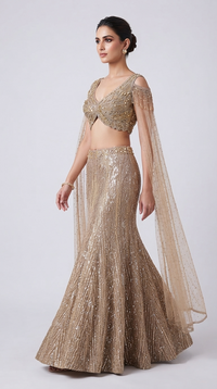 Champagne fish cut lehenga set front view with sequin, stone and cutdana embroidery and embellished blouse