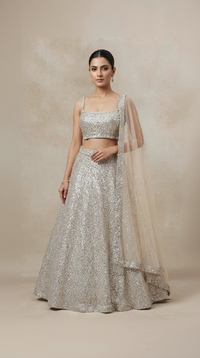 Ivory sequins embroidered lehenga choli set for sangeet and wedding celebrations