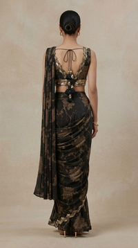 Back view of black printed ready-to-wear saree with embellished blouse, decorative tie-up and tassel details, perfect for weddings, receptions and festive events