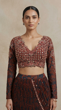 Wine hand embroidered blouse with intricate mirror work, beads, cutdana and sequins paired with a printed pre-draped saree for wedding events