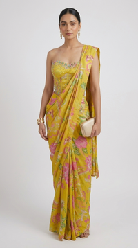 Yellow floral printed pre draped saree with gems embroidered corset blouse