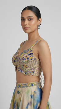 Cream embroidered lehenga choli with intricate detailing for haldi ceremony