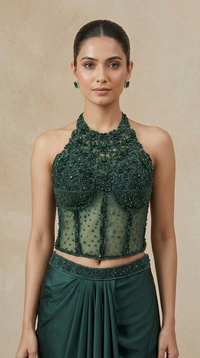 Full-length green embroidered corset and pleated skirt set, premium Indo Western wedding guest outfit for sangeet, reception, mehndi and celebrations.