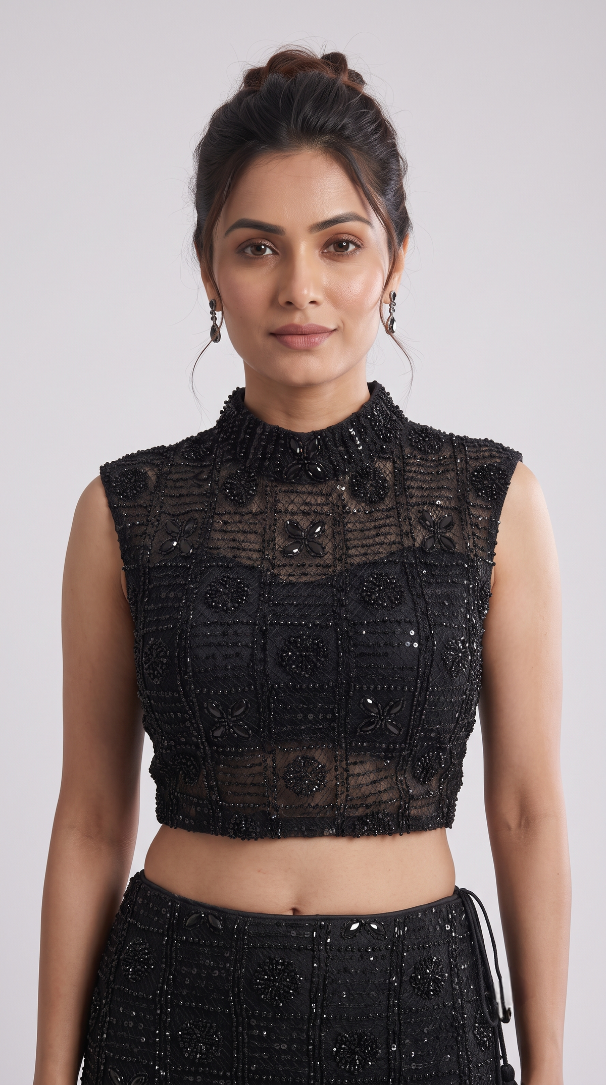 Black embellished blouse with beadwork paired with a statement skirt for wedding and festive wear
