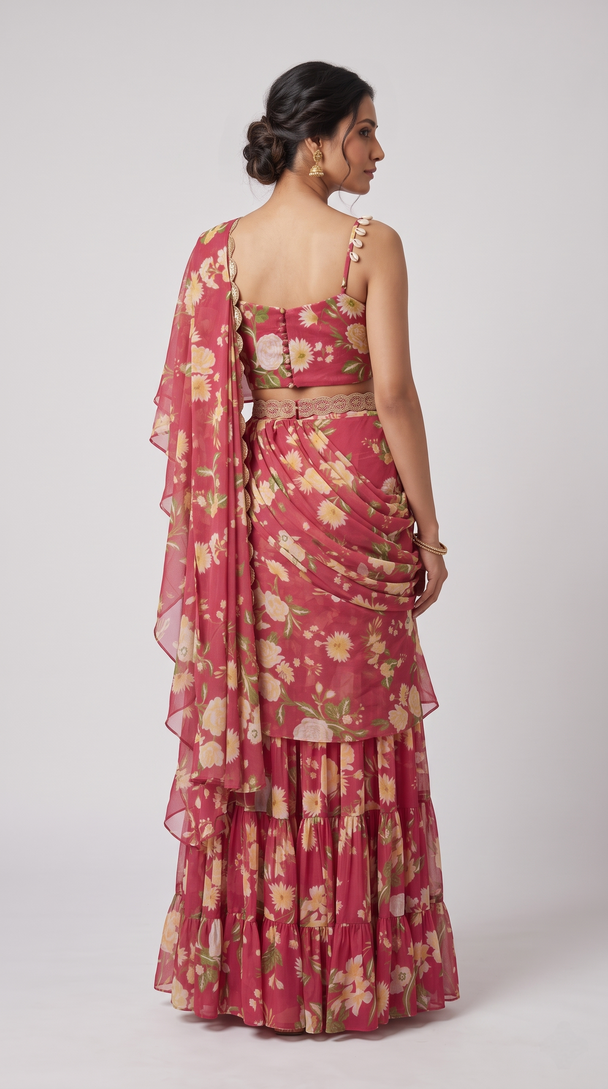 Pink embroidered floral saree with a pre-draped silhouette, contemporary Indian occasion wear for weddings and festive celebrations