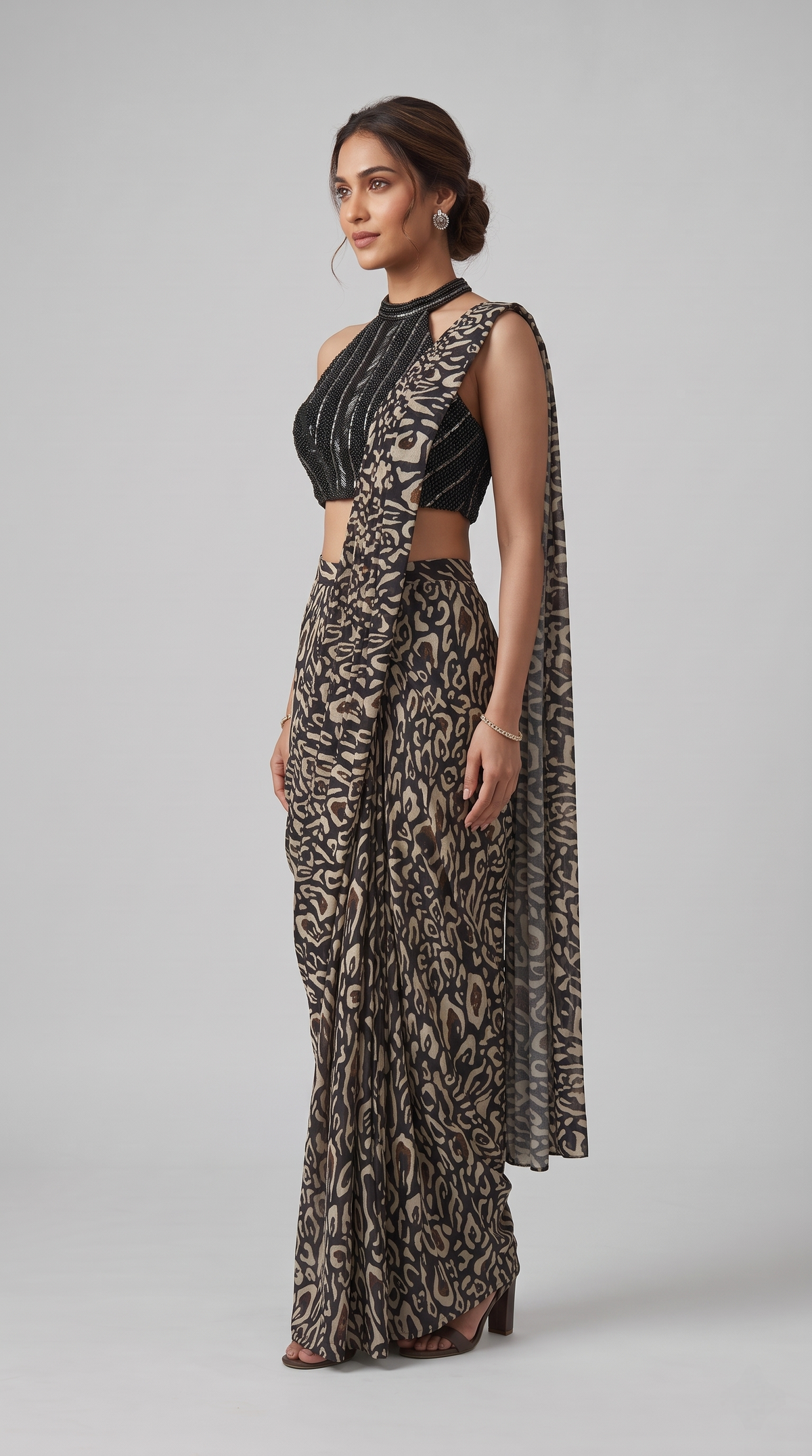 Stylish black printed pre-draped saree for women, perfect for cocktail parties, engagement ceremonies, wedding guest wear and celebrations.