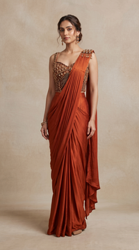 Rust designer pre-draped saree with beautiful gem embellishments, perfect for wedding guest outfits, cocktail parties and bridesmaid wear.