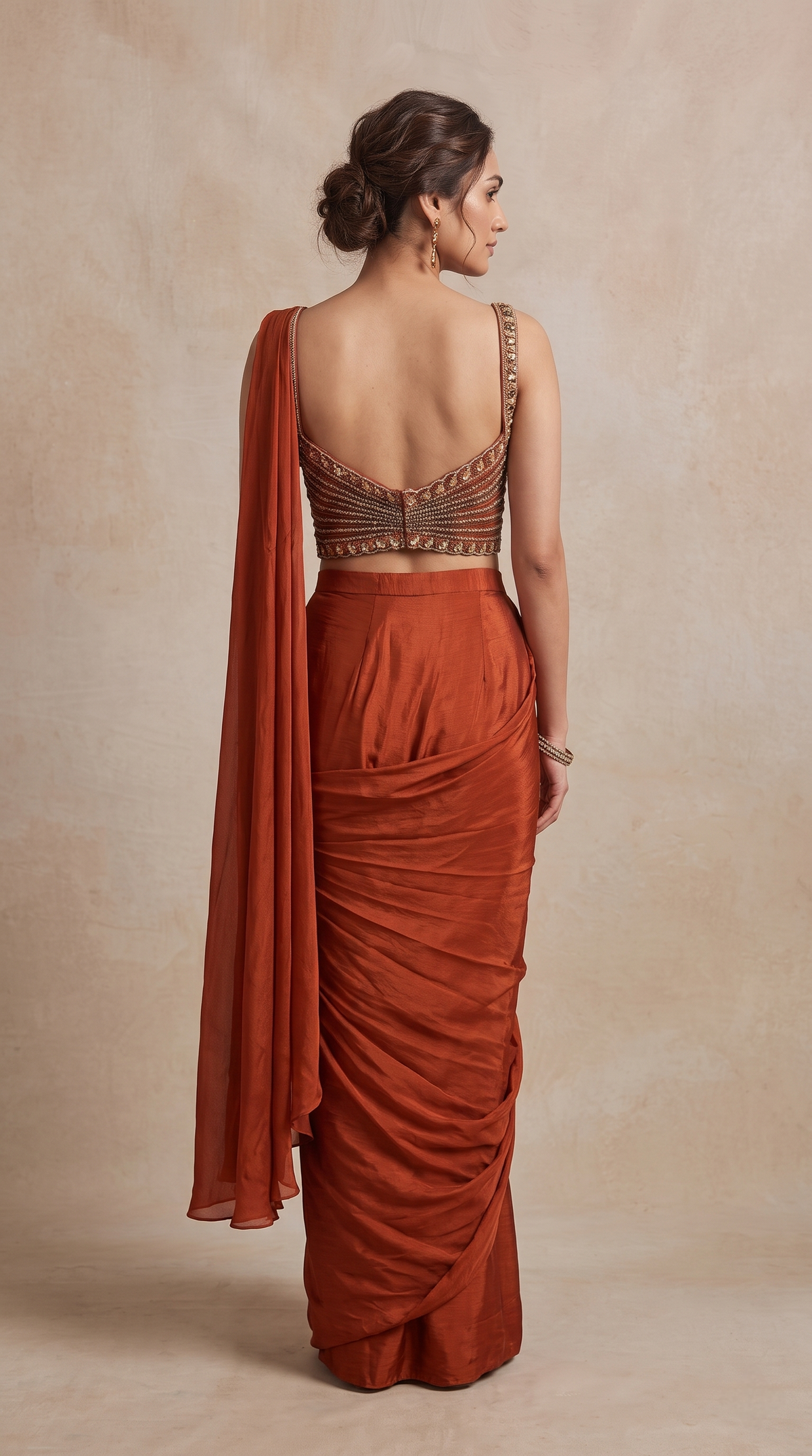 Stylish rust pre-draped saree for women, perfect for cocktail parties, wedding functions, bridesmaid outfits and special occasions.