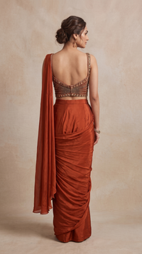 Stylish rust pre-draped saree for women, perfect for cocktail parties, wedding functions, bridesmaid outfits and special occasions.