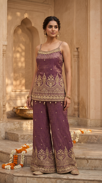 Stylish purple silk salwar suit with spaghetti strap top, perfect for wedding guest outfits, bridesmaid wear and traditional celebrations.