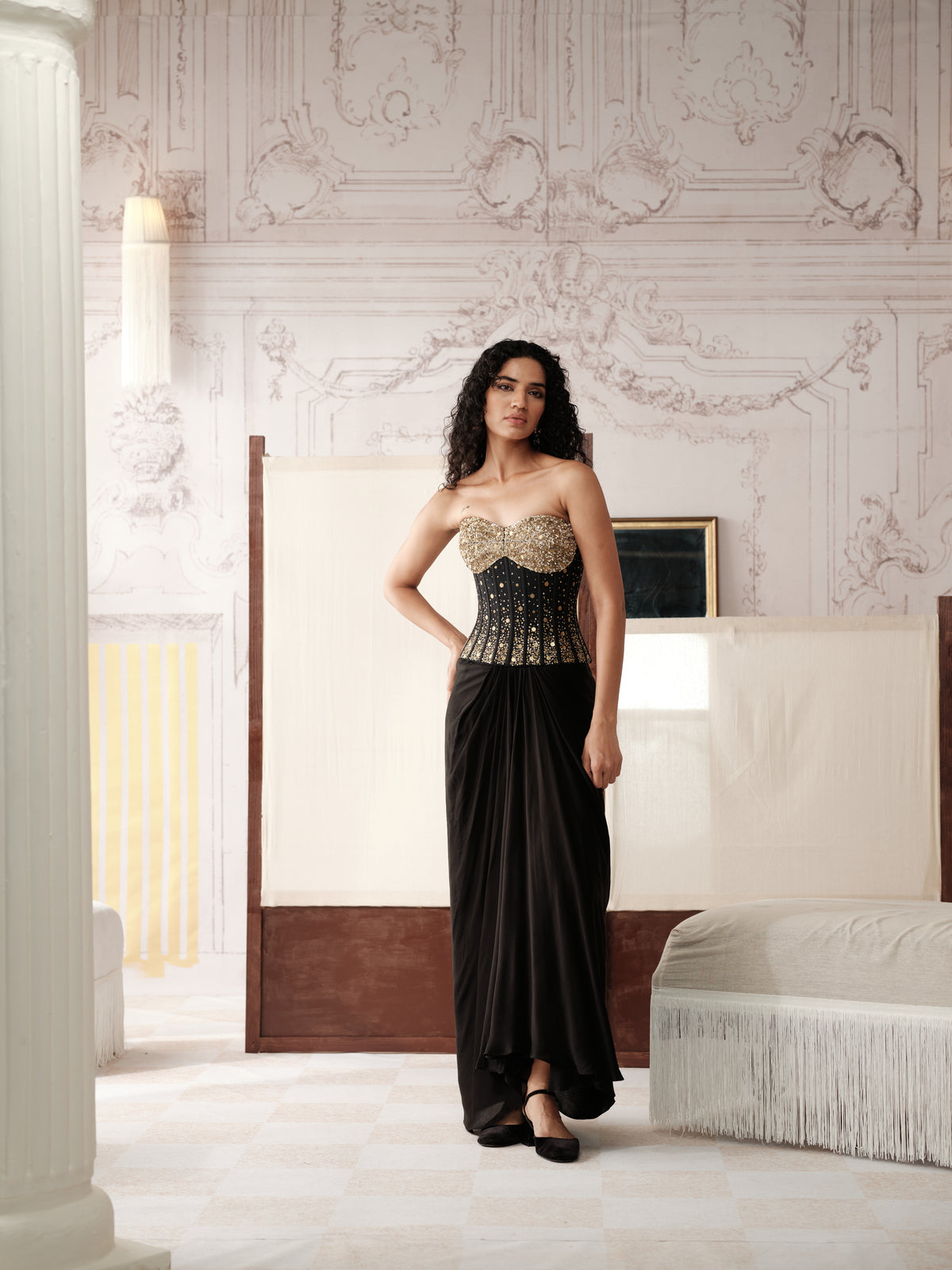 Black sculpted corset with pleated skirt for Sangeet party wear