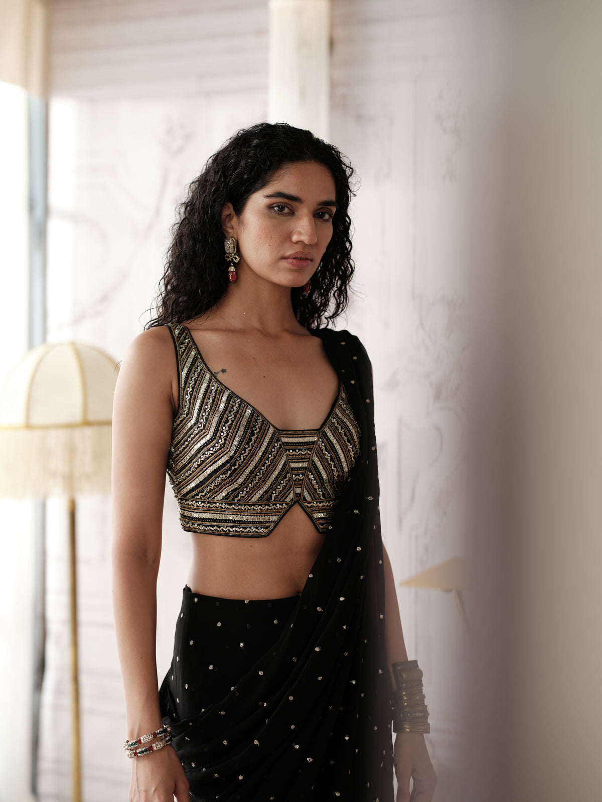 Black pre draped saree featuring gota lace and sequin embroidery