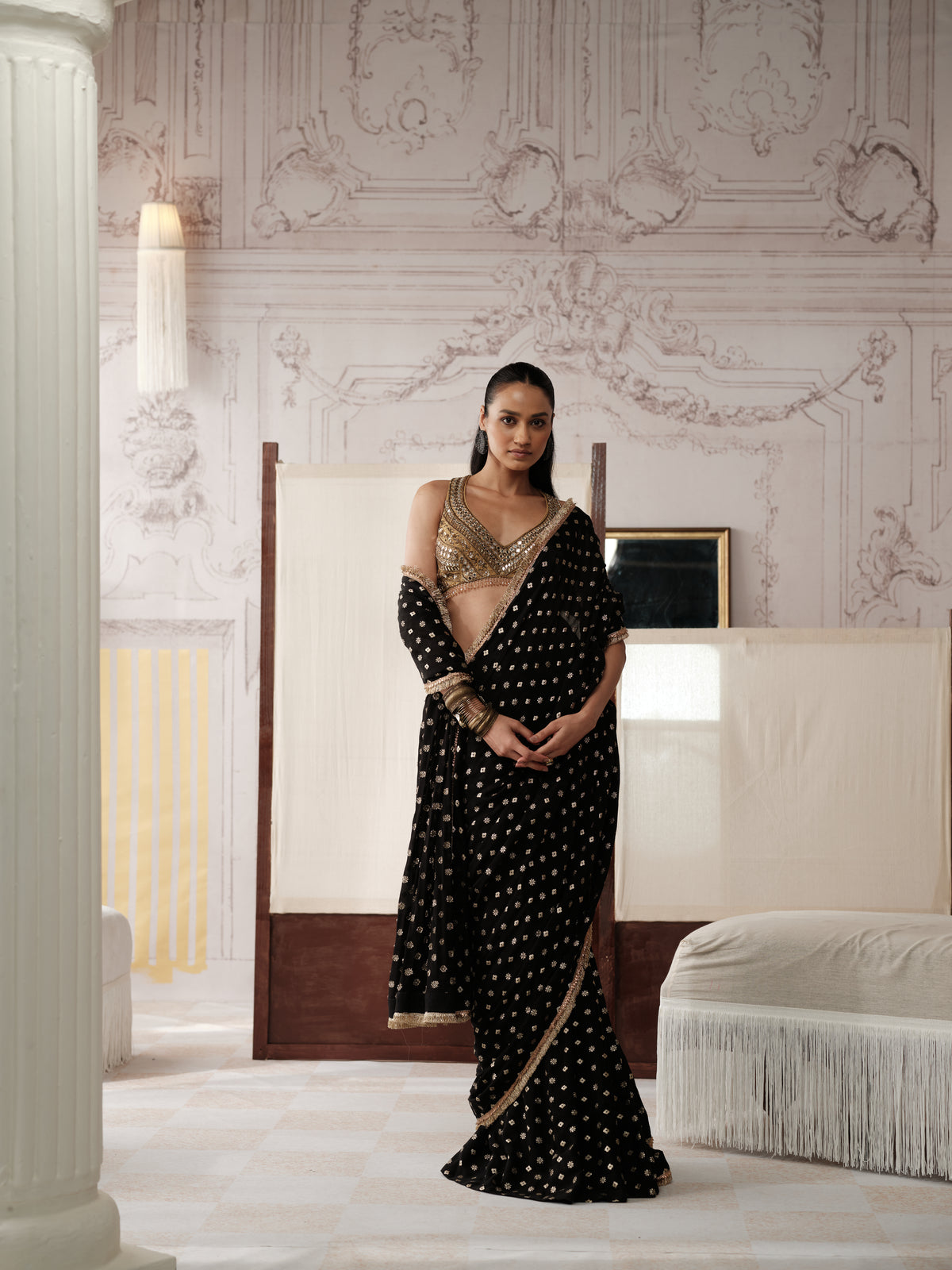 Black pre-draped mirror work saree with embellished blouse