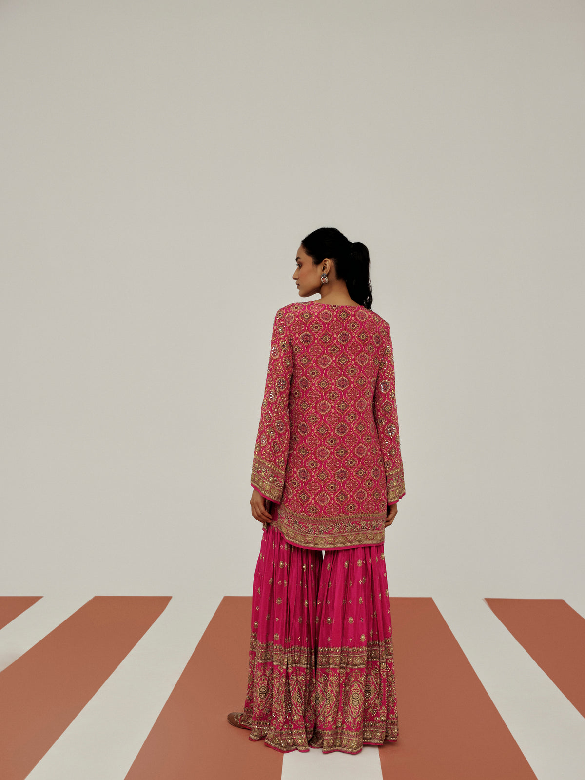 Pink ethnic sharara suit set for women, perfect for reception events, pre-wedding functions, festive wear, family celebrations and special occasions.