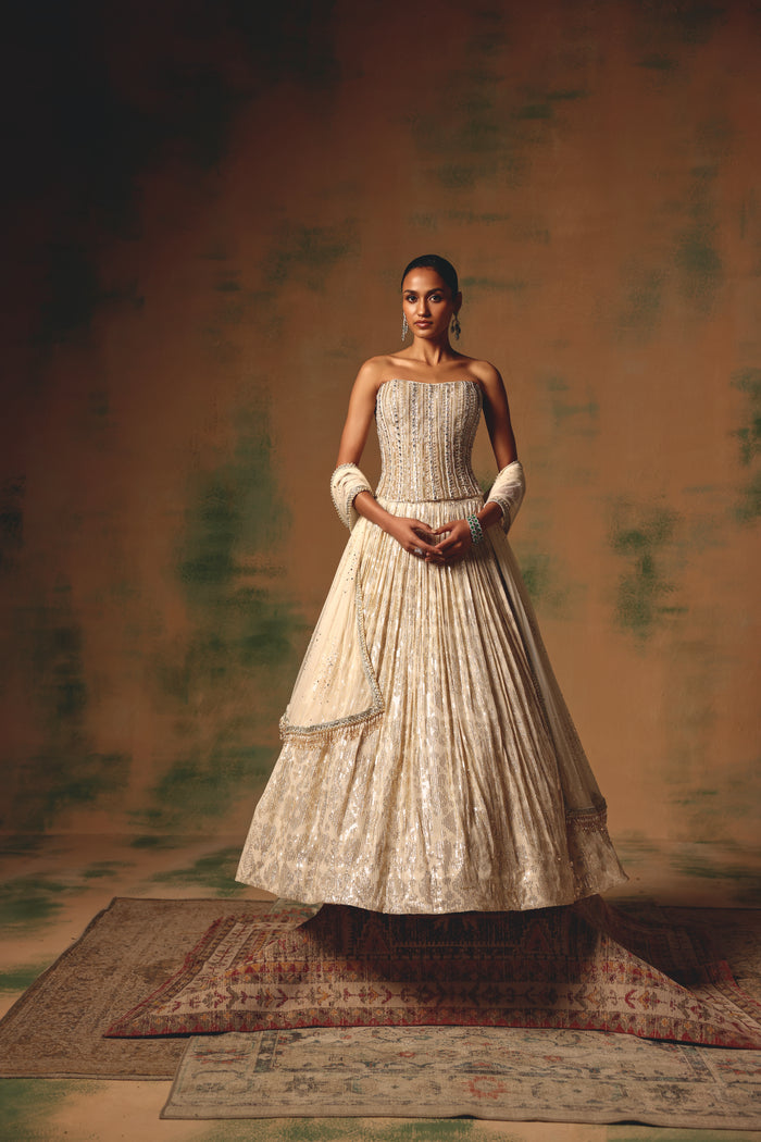 IVORY SEQUINS EMBROIDERED CORSET LEHENGA SET | Nishly Fashion House
