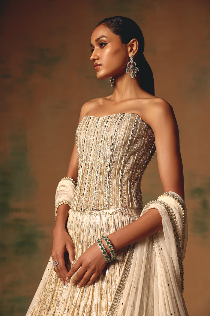IVORY SEQUINS EMBROIDERED CORSET LEHENGA SET | Nishly Fashion House