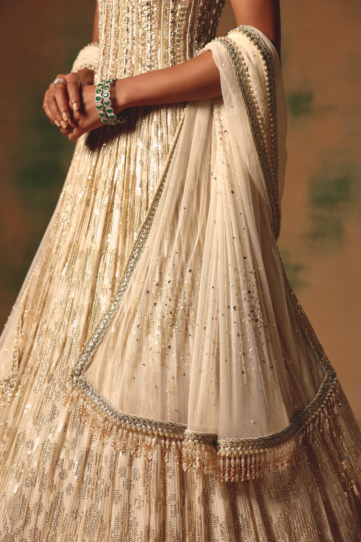 IVORY SEQUINS EMBROIDERED CORSET LEHENGA SET | Nishly Fashion House