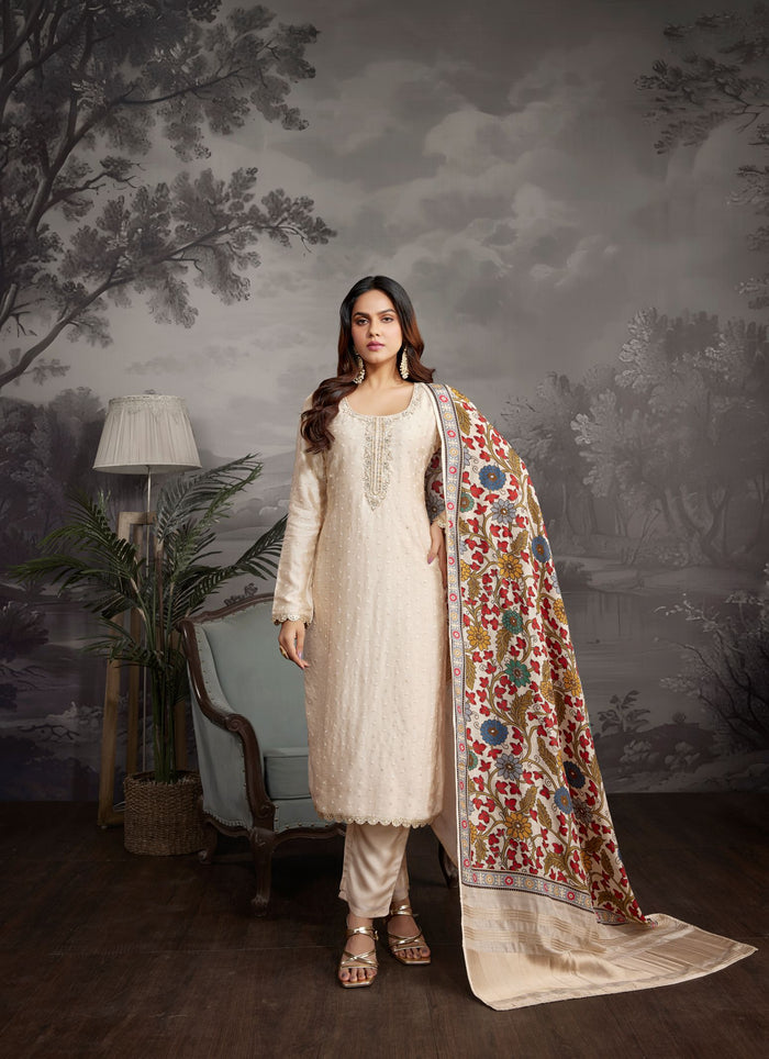 CREAM THREAD EMBROIDERED SALWAR SILK SUIT.