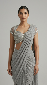 GREY NET PRE DRAPED SAREE WITH CRYSTAL EMBELLISHED BLOUSE