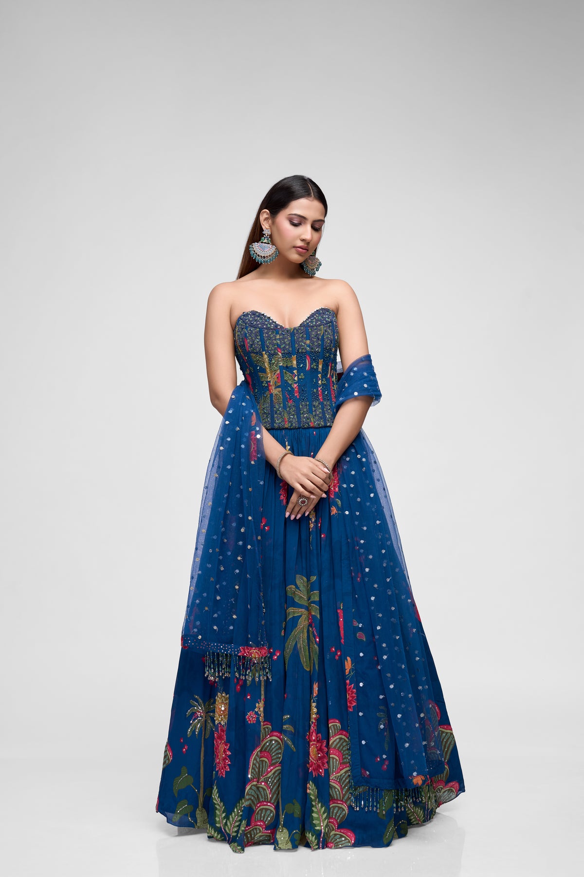 Blue beads embroidered printed corset lehenga choli set with embellished blouse, perfect for Indian weddings, sangeet, and festive celebrations.