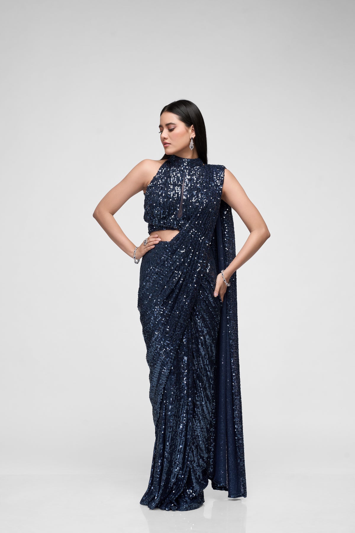 Blue sequin saree with shimmering embellishments for cocktail and party wear