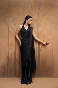 Black halter neck saree with bead embellishments for wedding and reception wear