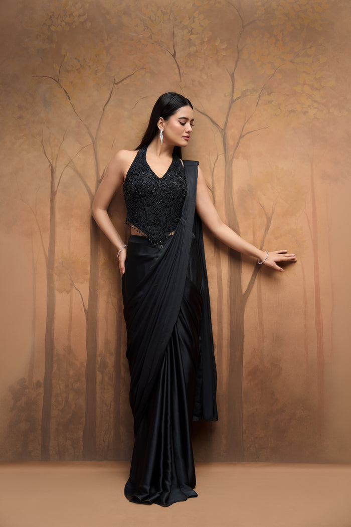 Black halter neck saree with bead embellishments for wedding and reception wear