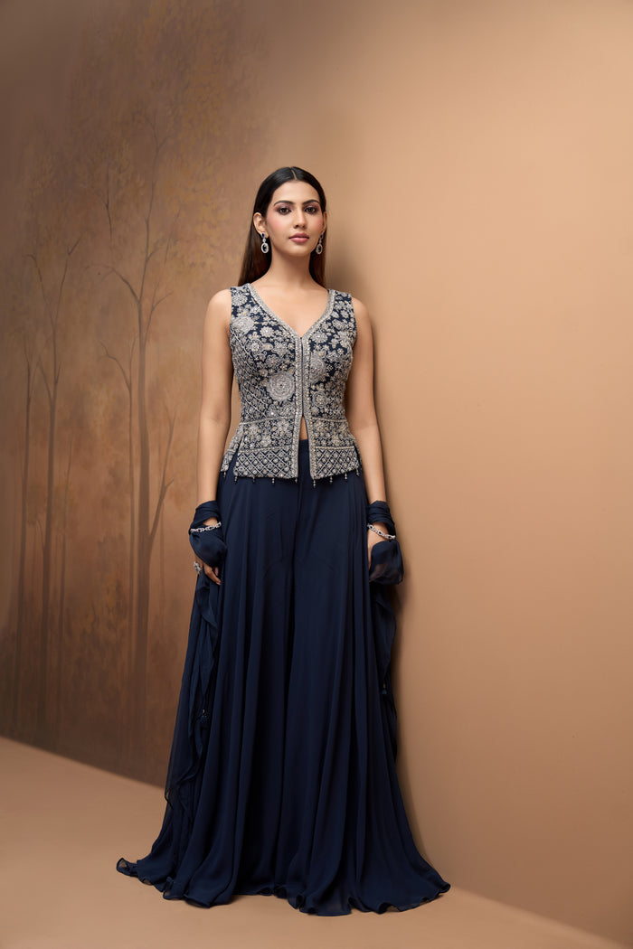 Blue mirror embroidered georgette sharara set with embellished blouse for wedding and sangeet celebrations.
