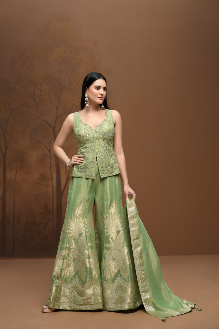 Green embroidered tissue silk salwar suit for sangeet and wedding celebrations