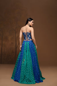 Detailed view of green mirror embroidered lehenga with contemporary corset blouse, perfect for sangeet, reception, engagement, and Indian wedding wear.