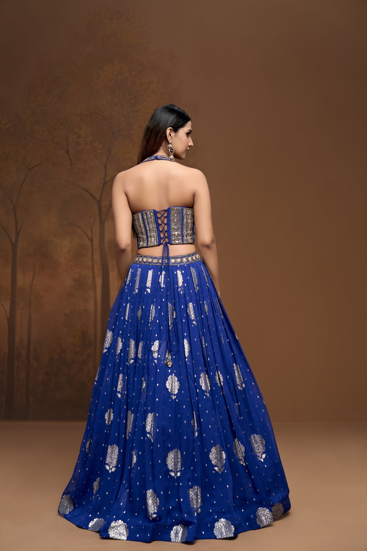 Detailed view of cobalt blue Banarasi lehenga choli with intricate embroidery and festive Indian wedding wear design.