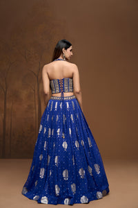 Detailed view of cobalt blue Banarasi lehenga choli with intricate embroidery and festive Indian wedding wear design.
