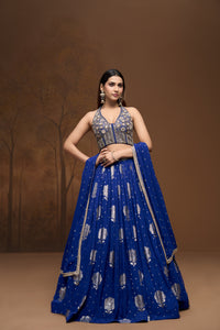 Cobalt blue Banarasi embroidered georgette lehenga choli set with intricate detailing for weddings and festive occasions.