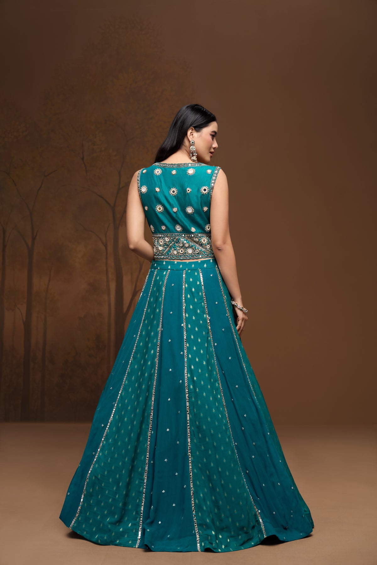 Close-up detail of green georgette lehenga with sparkling mirror embroidery and contemporary Indian ethnic wedding wear design.
