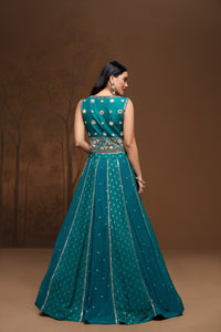 Close-up detail of green georgette lehenga with sparkling mirror embroidery and contemporary Indian ethnic wedding wear design.