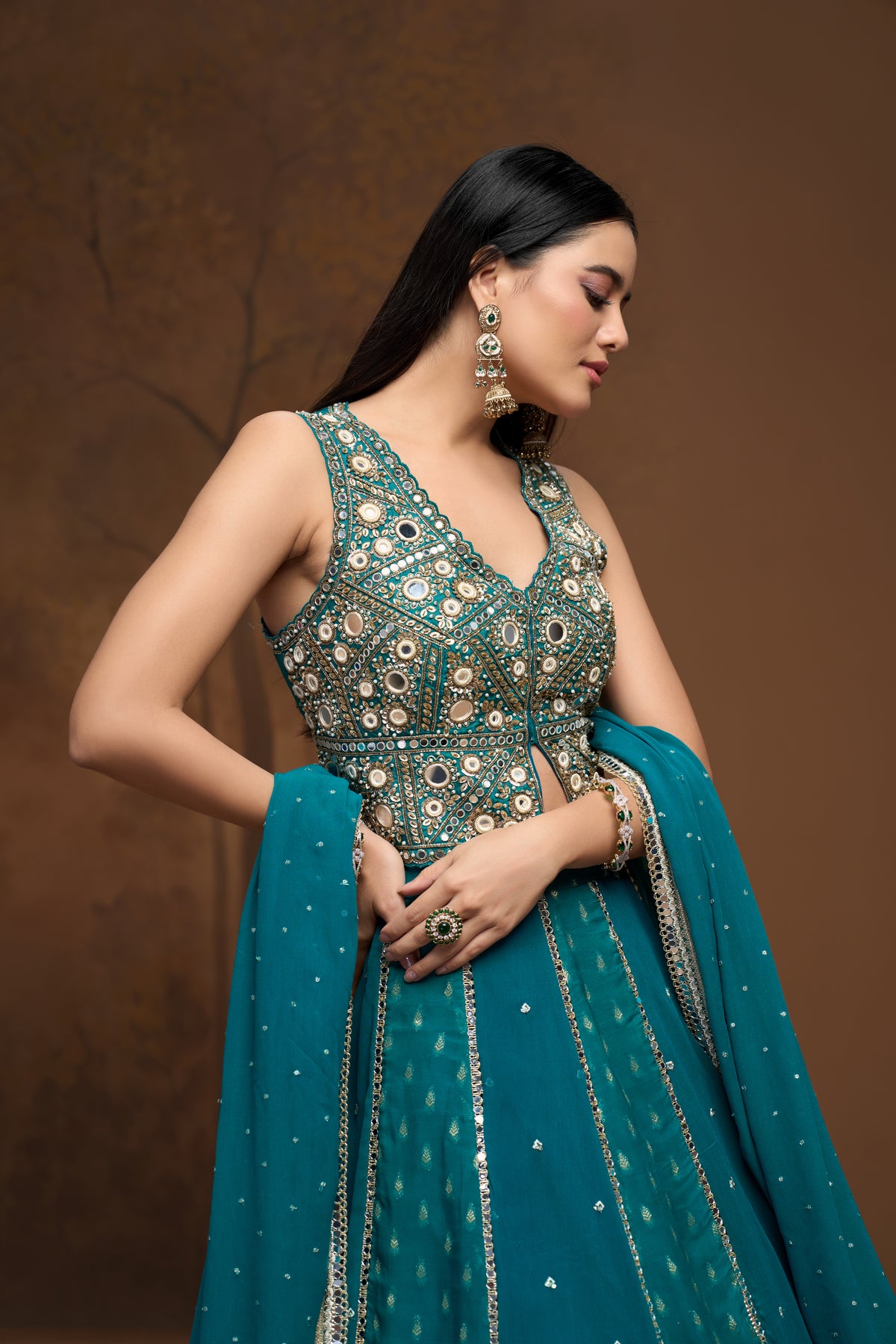Stylish green mirror work lehenga choli set for weddings, receptions, engagements, and festive party wear.