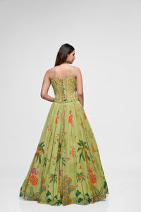 Detailed view of green printed lehenga with flower embroidery and contemporary corset blouse, perfect for sangeet, reception, and party wear.