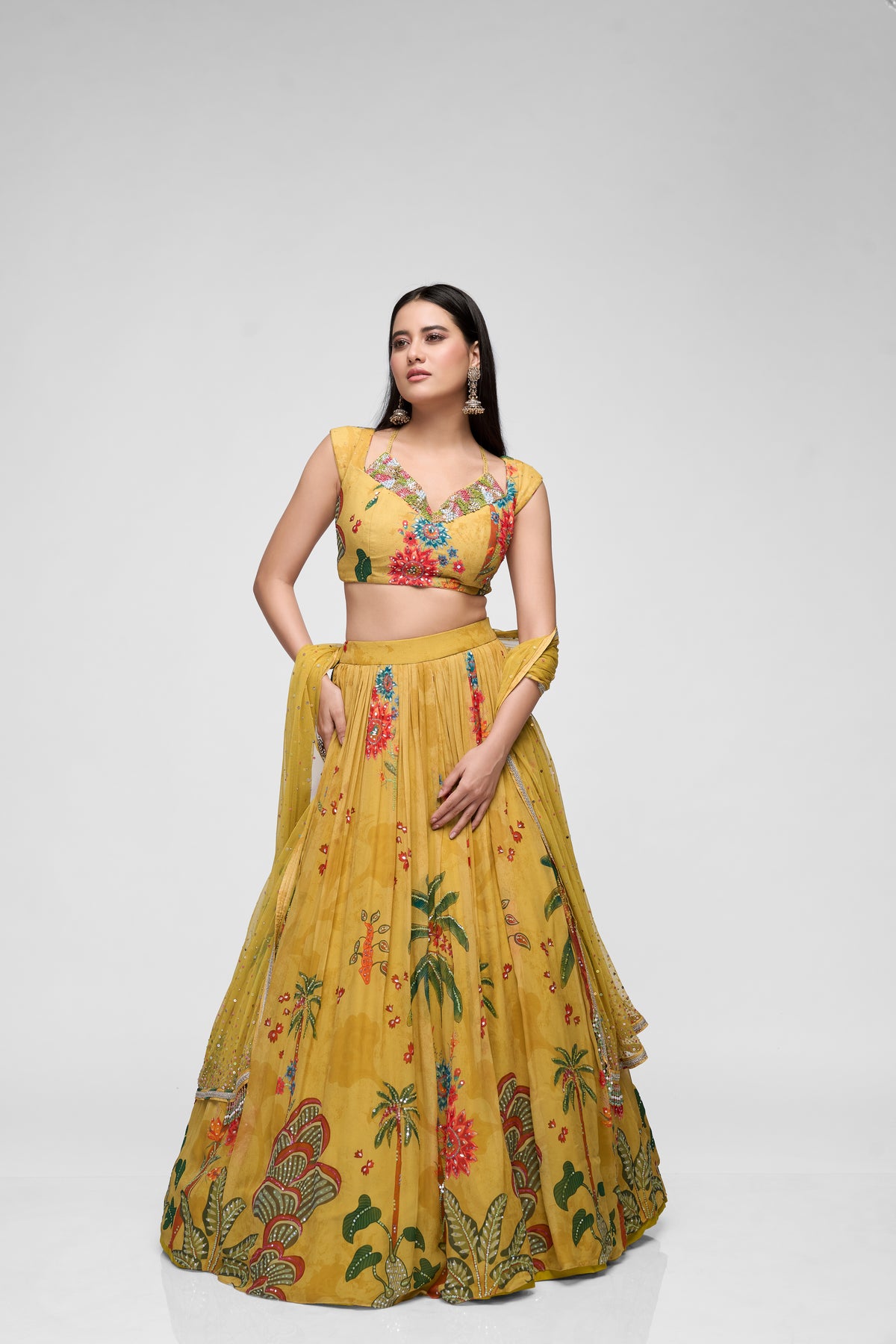 Mustard yellow sequins embroidered printed georgette lehenga set with cap sleeves, perfect for Indian wedding and festive celebrations.