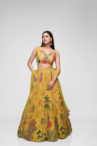Mustard yellow sequins embroidered printed georgette lehenga set with cap sleeves, perfect for Indian wedding and festive celebrations.