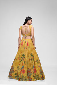 Detailed view of mustard printed georgette lehenga with intricate sequin embroidery and cap sleeve blouse, perfect for festive Indian ethnic and wedding wear.