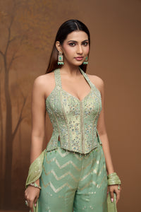 Designer green tissue silk sharara set with embroidered corset blouse for wedding celebrations