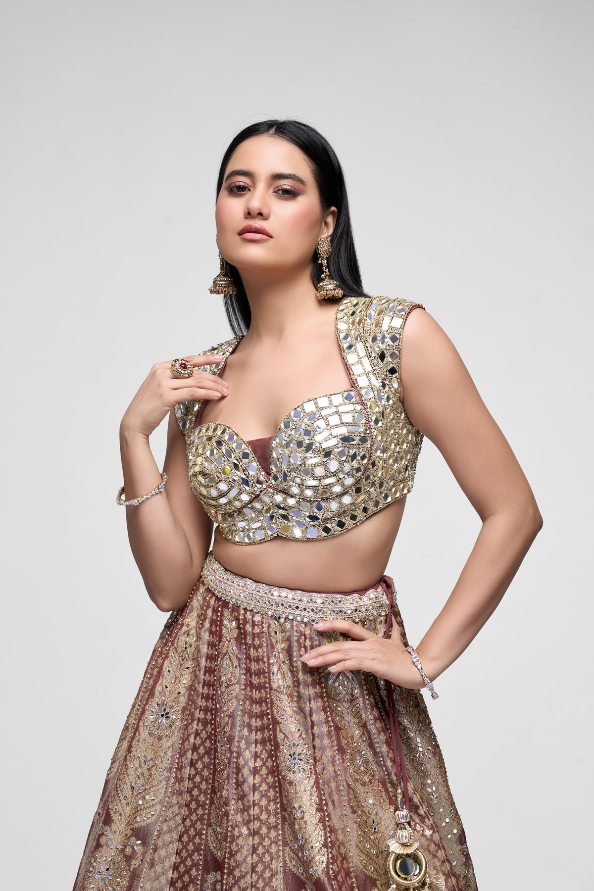 Banarasi tissue silk bridal lehenga in brown with detailed mirror embroidery and traditional wedding blouse