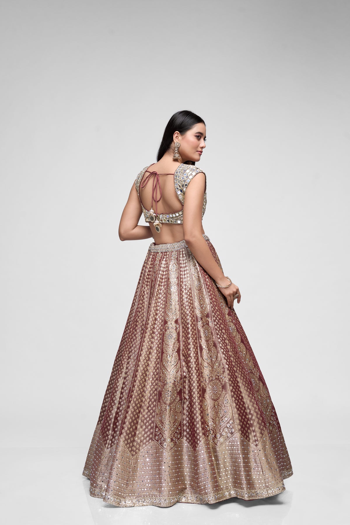 Elegant brown Banarasi wedding lehenga with mirror embroidered blouse and traditional Indian bridal detailing