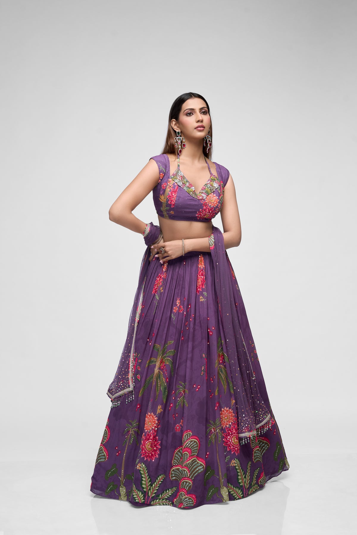 Purple sequins embroidered printed georgette lehenga set with cap sleeve blouse, perfect for Indian weddings and festive celebrations.