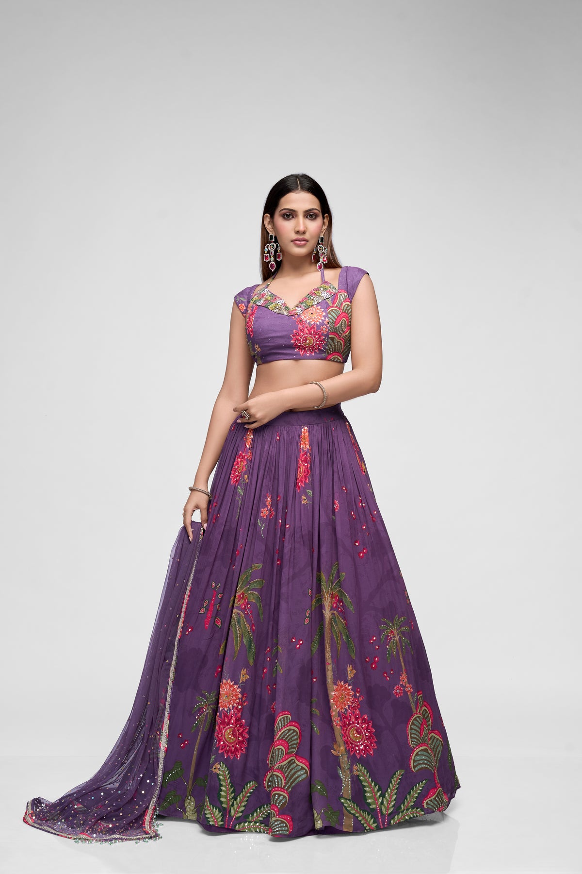Front view of purple embroidered lehenga choli with cap sleeves, sparkling sequins, and printed georgette fabric for sangeet and reception wear.