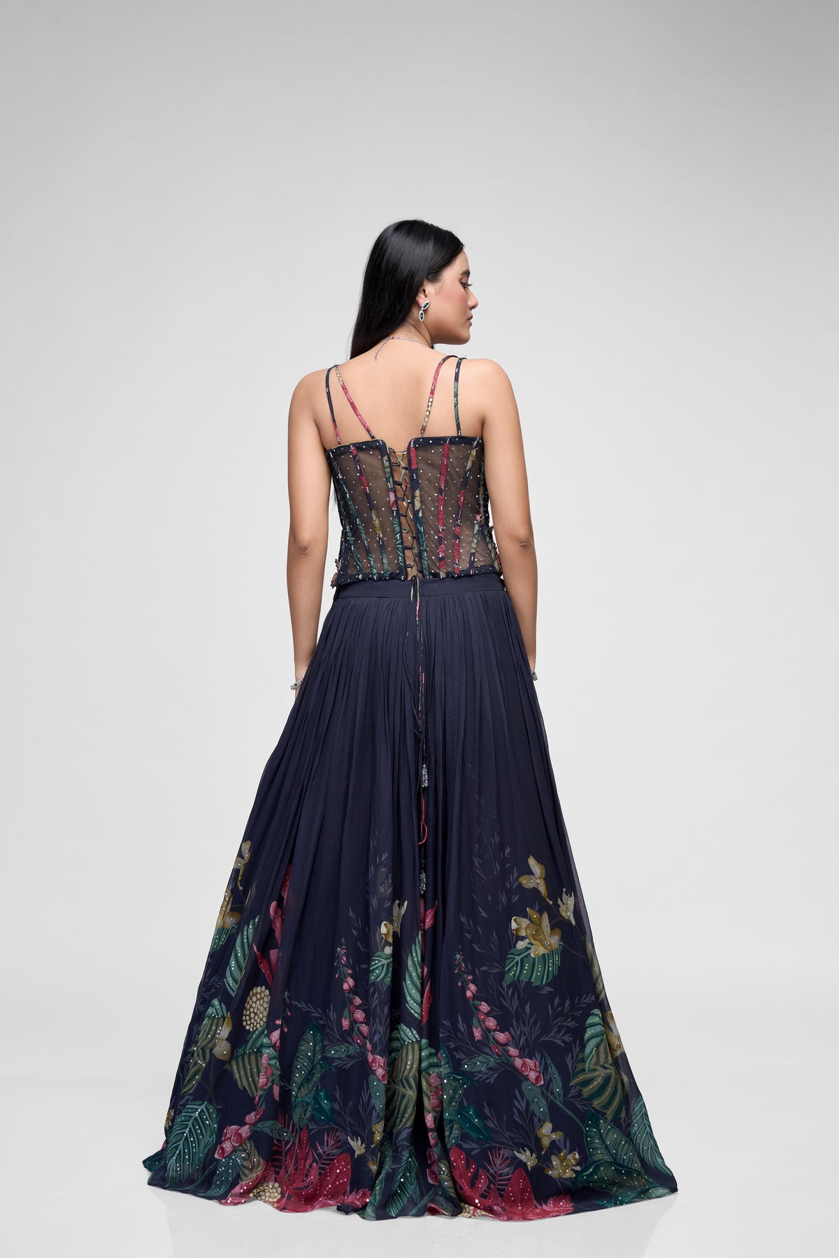 Detailed view of black printed georgette lehenga with flower embroidery and contemporary corset blouse, perfect for sangeet, reception, and party wear.