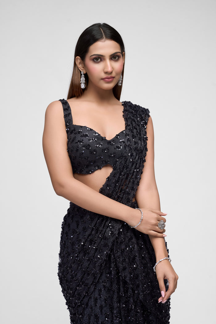 Black sequin saree with embroidered detailing for wedding and reception wear